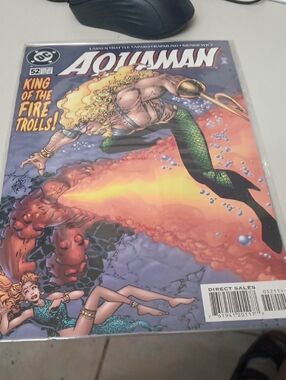 DC Aquaman Comic Cover with Green Tail and Orange Flame In A Sleeve